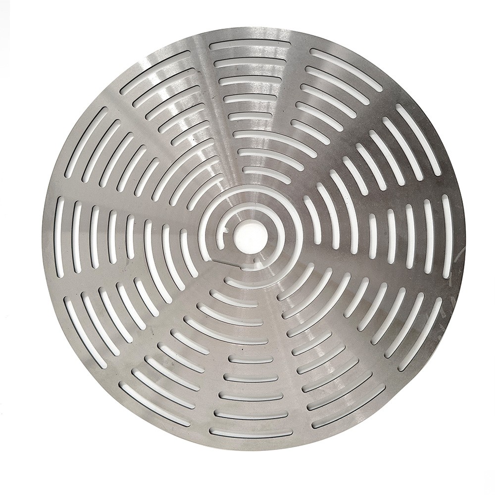 Metal compressor valve plate with radial slots on a white background